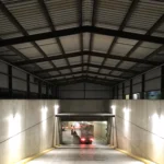 Underground parking garage entrance with lights