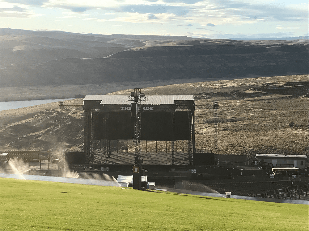 Outdoor concert stage in scenic landscape
