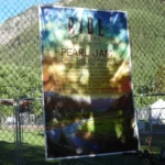Music festival poster on chain-link fence