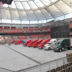 Stadium interior with parked trucks