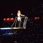 Artist singing on a platform