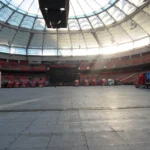 Empty stadium with concert trucks