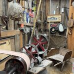 Vintage workshop with old tools and machinery.
