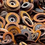 A pile of rusty metal gears and wheels.